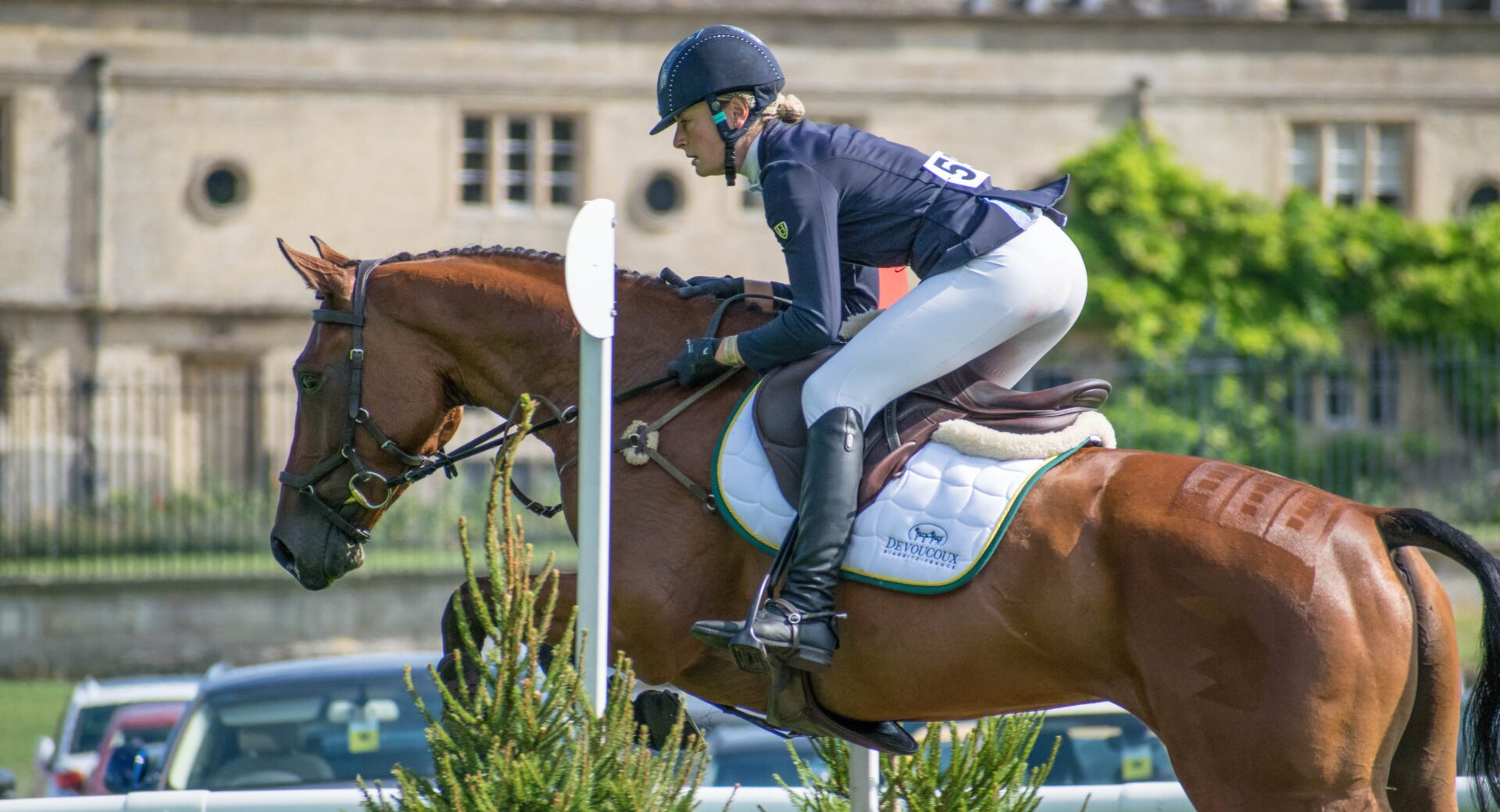 Caroline Harris and horse jumping at eventing competition. 