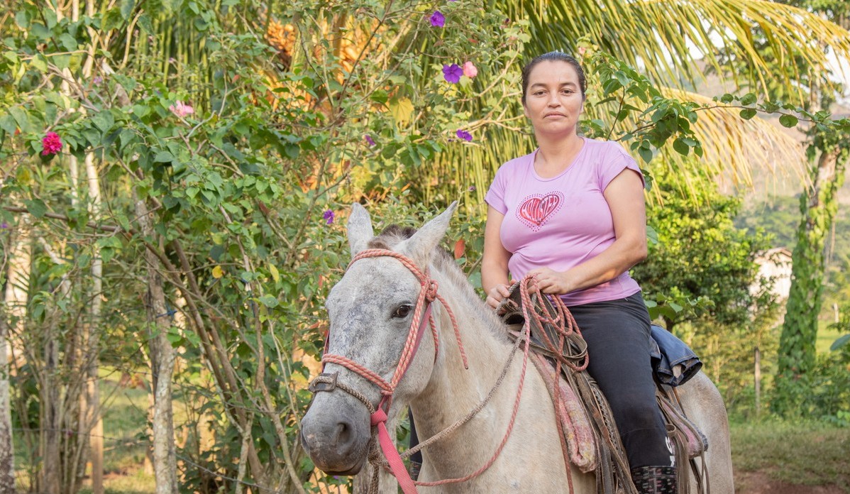 Woman rides horse in Nicaragua.