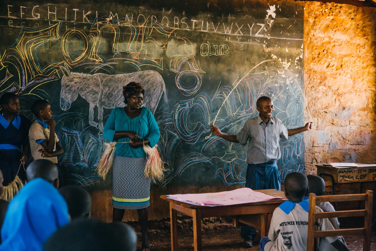 Teacher and students at Kenyan donkey care club