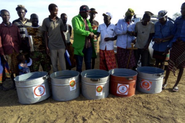 Water is handed over to a community group in Nanam Water is handed over to a community group in Nanam