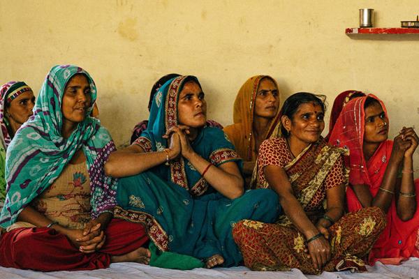 A group of women sitting on the floor A group of women sitting on the floor