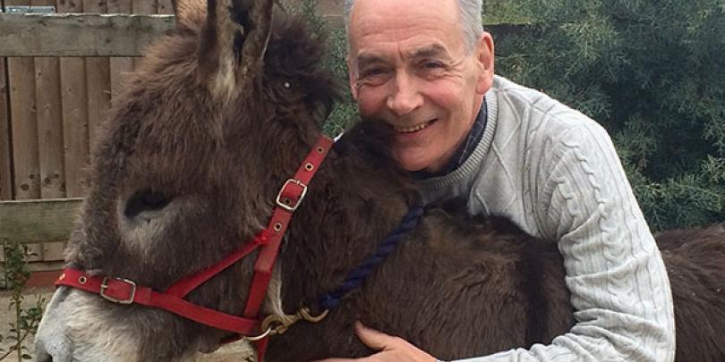 Alastair Stewart with one of his donkeys, Hob Nob