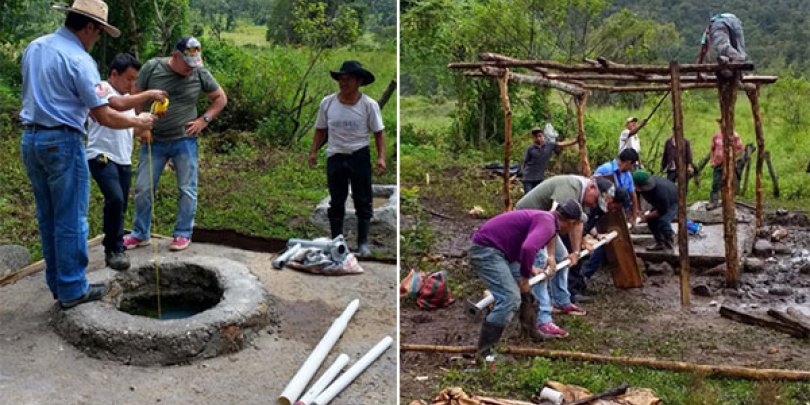 Community members working together to install the water pump Community members working together to install the water pump