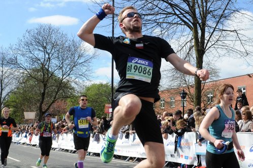 Runner jumping in celebration during race