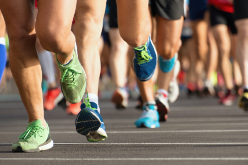 An image of runners legs and trainers in action