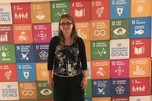 Brooke's Anna Marry stands wearing black against a multi-coloured backdrop