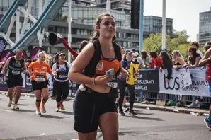 Female runner crossing bridge 2026 London Marathon
