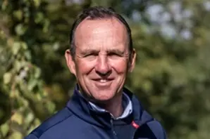 Major Richard Waygood MBE stands outside in front of trees