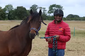 Brooke staff with horse at Redwings Horse Sanctuary in Norfolk 
