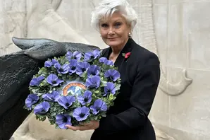 Angela Rippon holding wreath at London memorial service