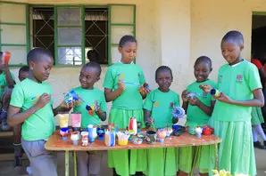 School children in Kenya decorate plastic bottles