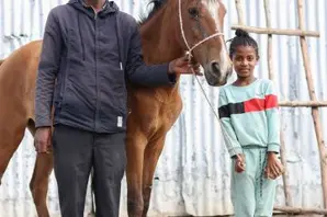 A man, a horse and a girl