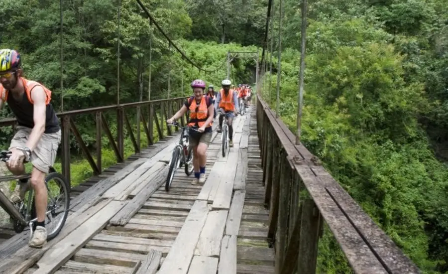 Cyclists travelling over bridge