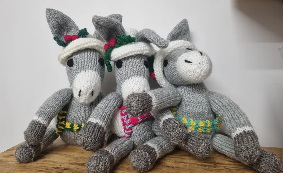 three knitted Doris the Donkeys from Brooke Christmas Craft Pack