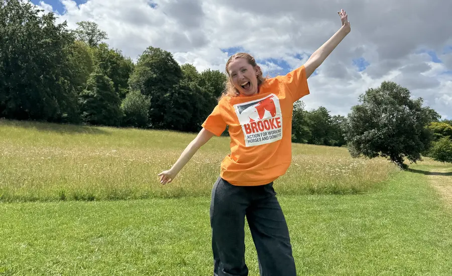 Brooke supporter in orange t-shirt in field