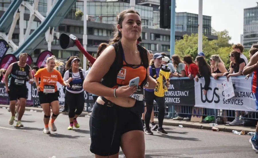Female runner crossing bridge 2026 London Marathon