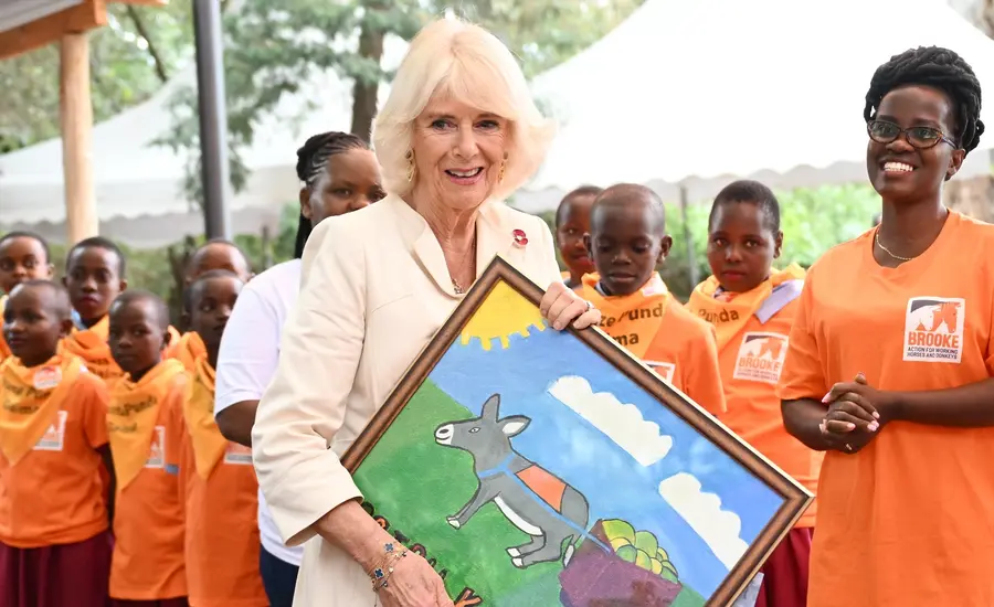 Queen Camilla meets students from a Donkey Care Club. Photo credit Samir Hussein/WireImage