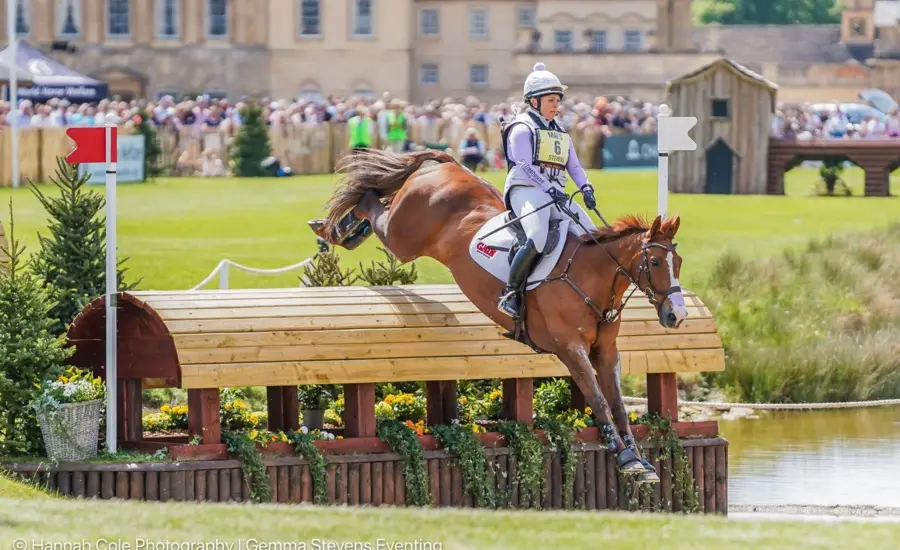 Gemma Stevens and horse jumping on eventing course at Badminton Horse Trials 2025.