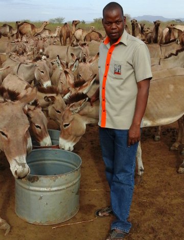 James inspects empty drums after the water pump had no fuel for 3 days James inspects empty drums after the water pump had no fuel for 3 days