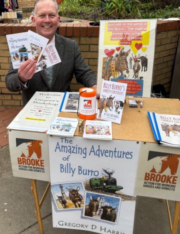 Gregory Harris at his market stand selling books for charity in Saltburn-by-the-Sea