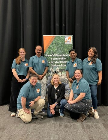 Brooke's team by banner at vet congress in Liverpool