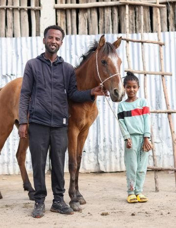A man, a horse and a girl A man, a horse and a girl