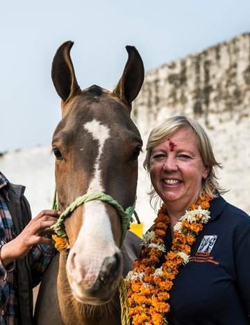 Deborah Meaden next to a horse