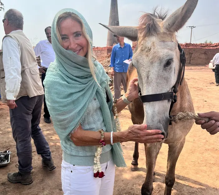 Klare Kennett, Brooke's Head of Brand Marketing and Communications, in Pakistan with a working equid.
