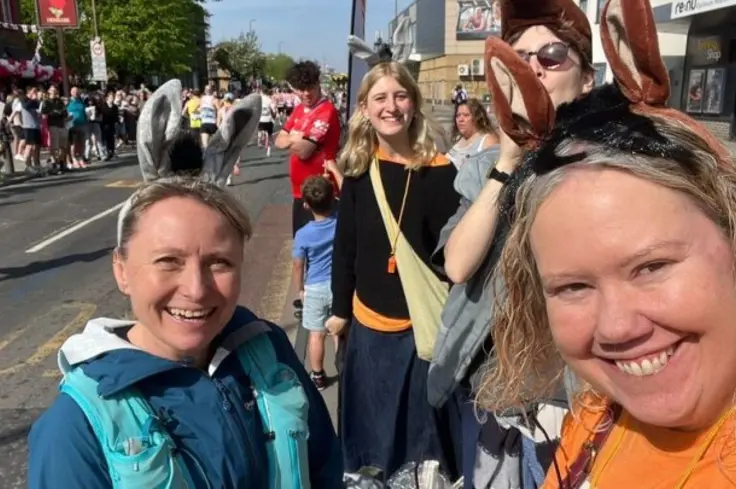 Brooke staff - wearing donkey ears - supporting runners at the London Marathon.
