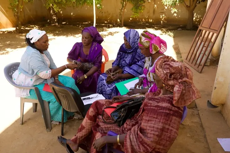 Community members in Matam, Senegal engaging in discussion within an all-female group setting