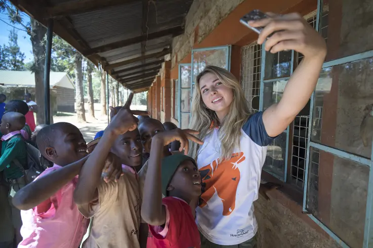 Hannah Russell with school children, Kenya