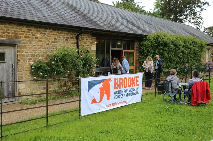 A Brooke sign is set up across the garden