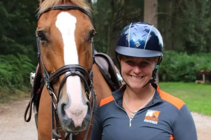 Gemma Stevens with horse wearing Brooke branded top. 