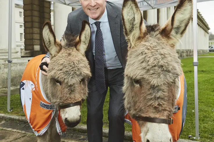 Rory Bremner with donkeys at charity carol service
