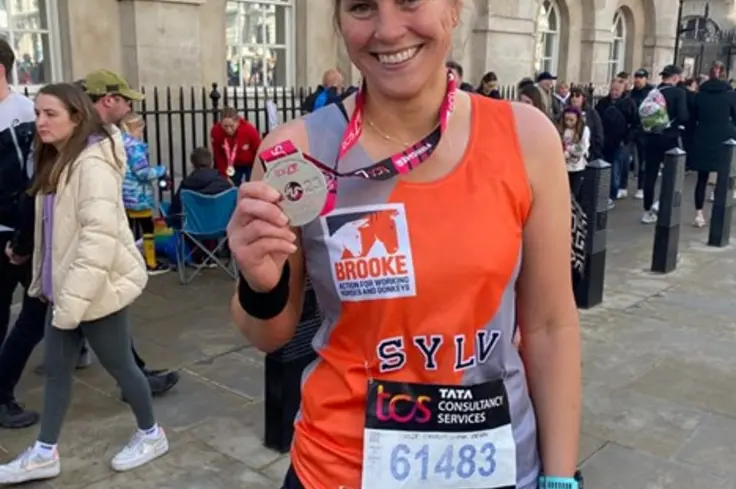 Brooke supporter with medal after London Marathon 2024